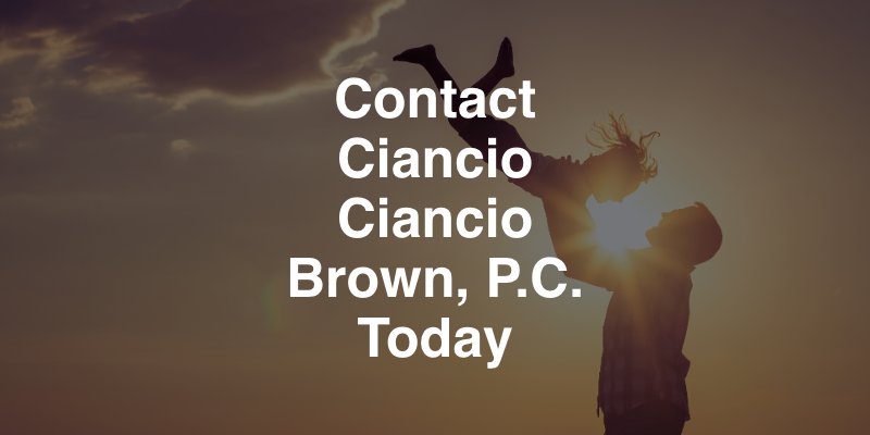 Contact Ciancio Ciancio Brown, P.C. today, father lifting child into air with a sunset backdrop